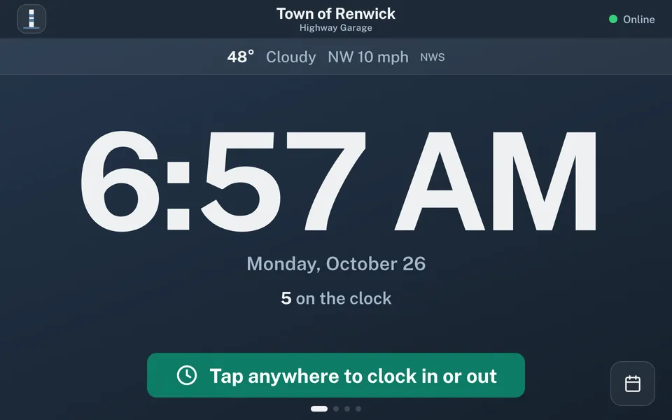 Wall station idle screen. A large clock reads 6:57 AM, with the date and a count of 5 on the clock, above a green button that reads Tap anywhere to clock in or out.
