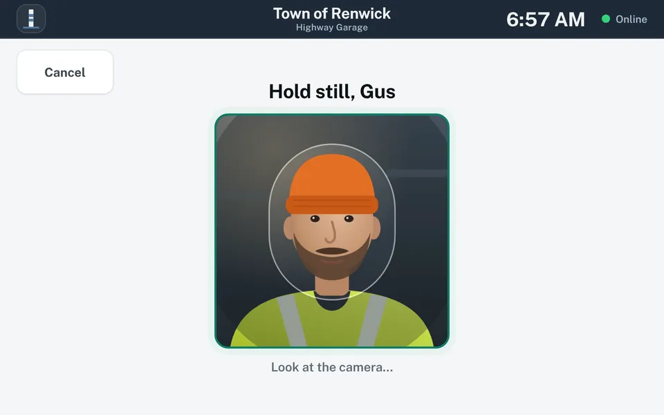 Photo screen titled Hold still. A camera view frames the crew member’s face and shoulders, with the prompt Look at the camera.